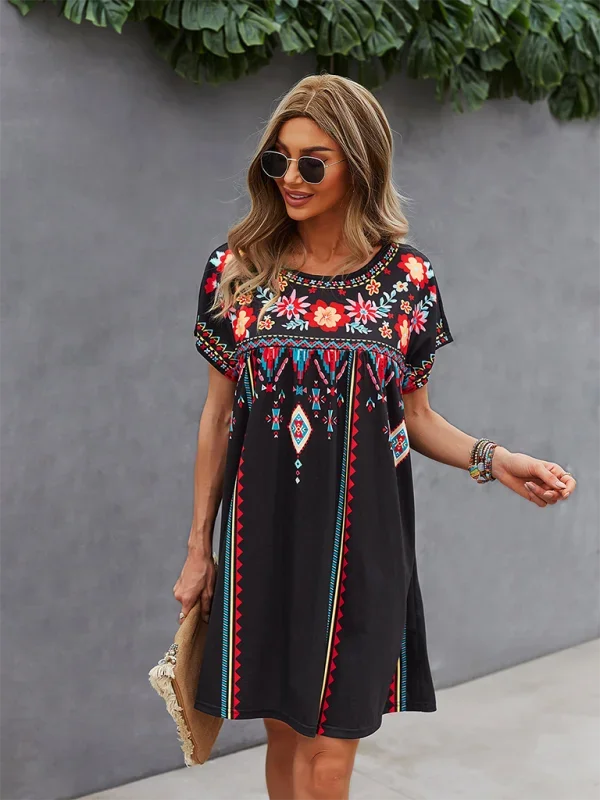 "Jaclyn mini dress featuring intricate floral embroidery on soft, flowing fabric in a boho style design."