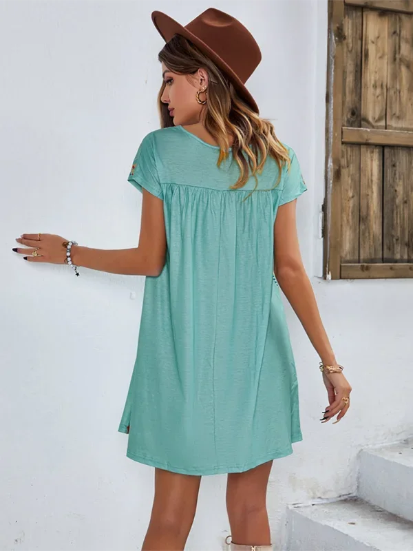"Jaclyn embroidered boho mini dress in soft cotton fabric, featuring intricately embroidered details and a relaxed fit."