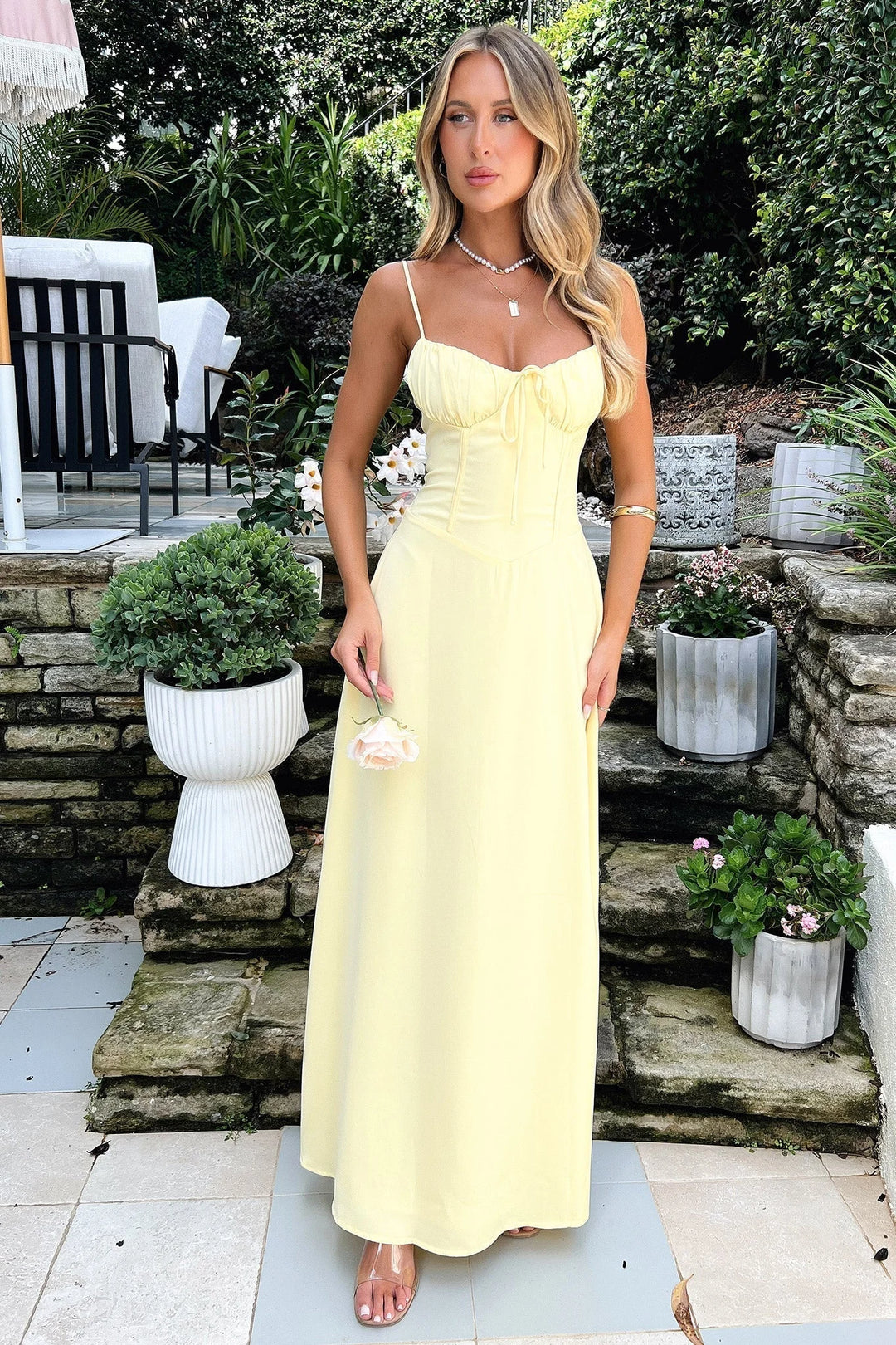 Flowy navy blue maxi dress with adjustable straps, ideal for casual chic looks in lightweight, breathable fabric.