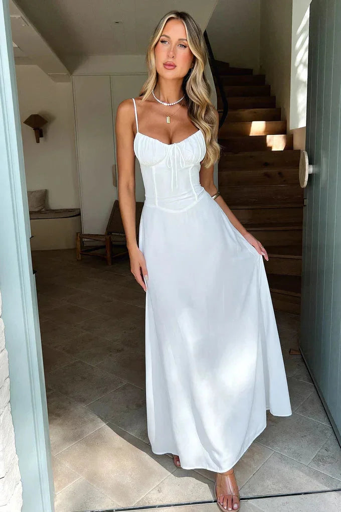 "Jadyn flowy maxi dress in soft cotton-modal blend, adjustable straps, subtle pleats, and elegant draped silhouette."