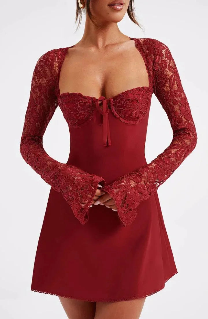 "Black mini dress featuring delicate lace detailing and a charming bow accent, perfect for a sophisticated and elegant look."