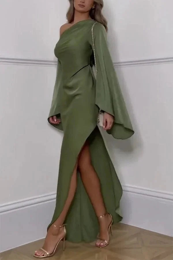 Off-shoulder olive dress with side slit, made of soft and flowy fabric.