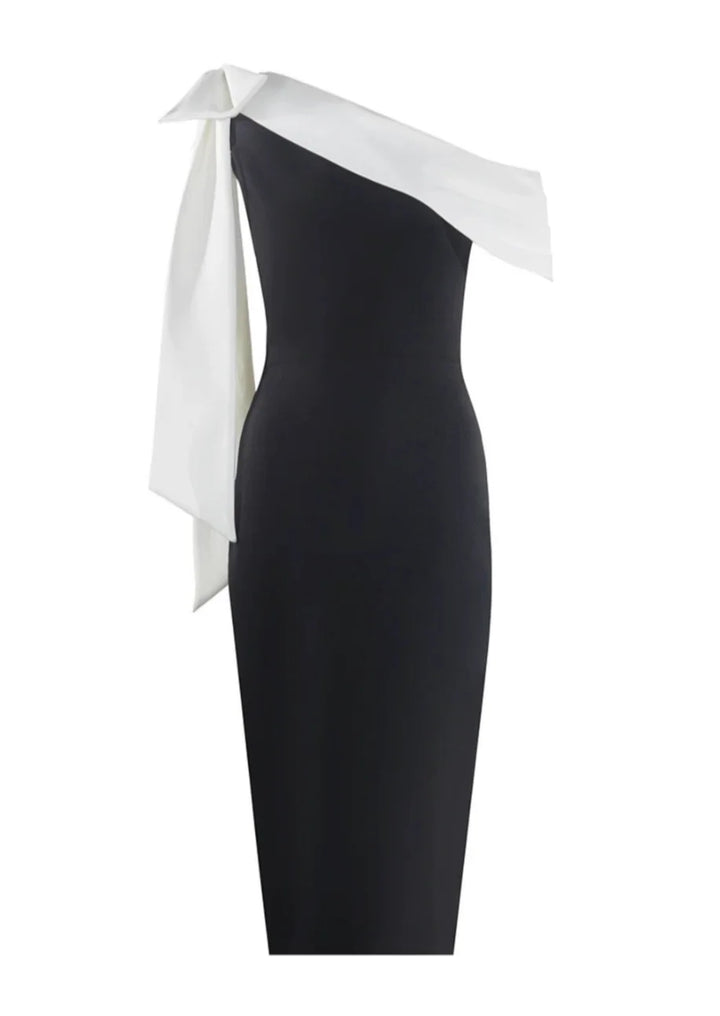"Black and white midi dress with asymmetrical design, made from soft and lightweight fabric, perfect for a modern chic look."