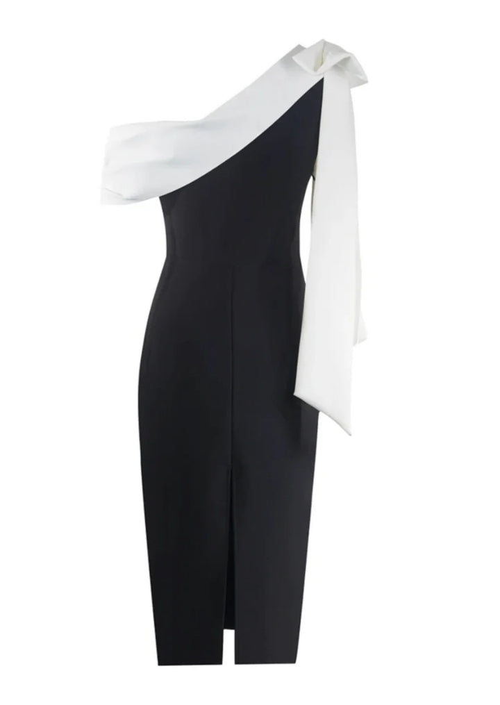 Black and white midi dress with asymmetrical design, made of soft cotton blend fabric, perfect for a modern and chic look.