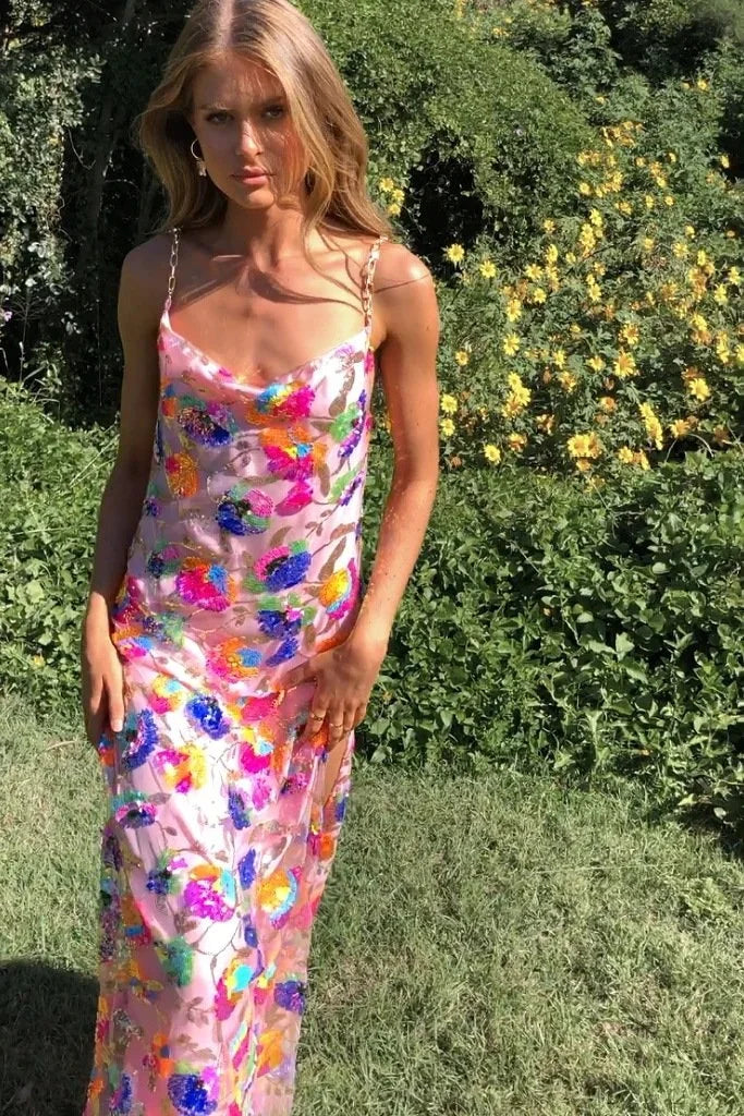 "Janessa floral dress with leg slit in soft cotton blend with vibrant floral pattern, perfect for a stylish and feminine…