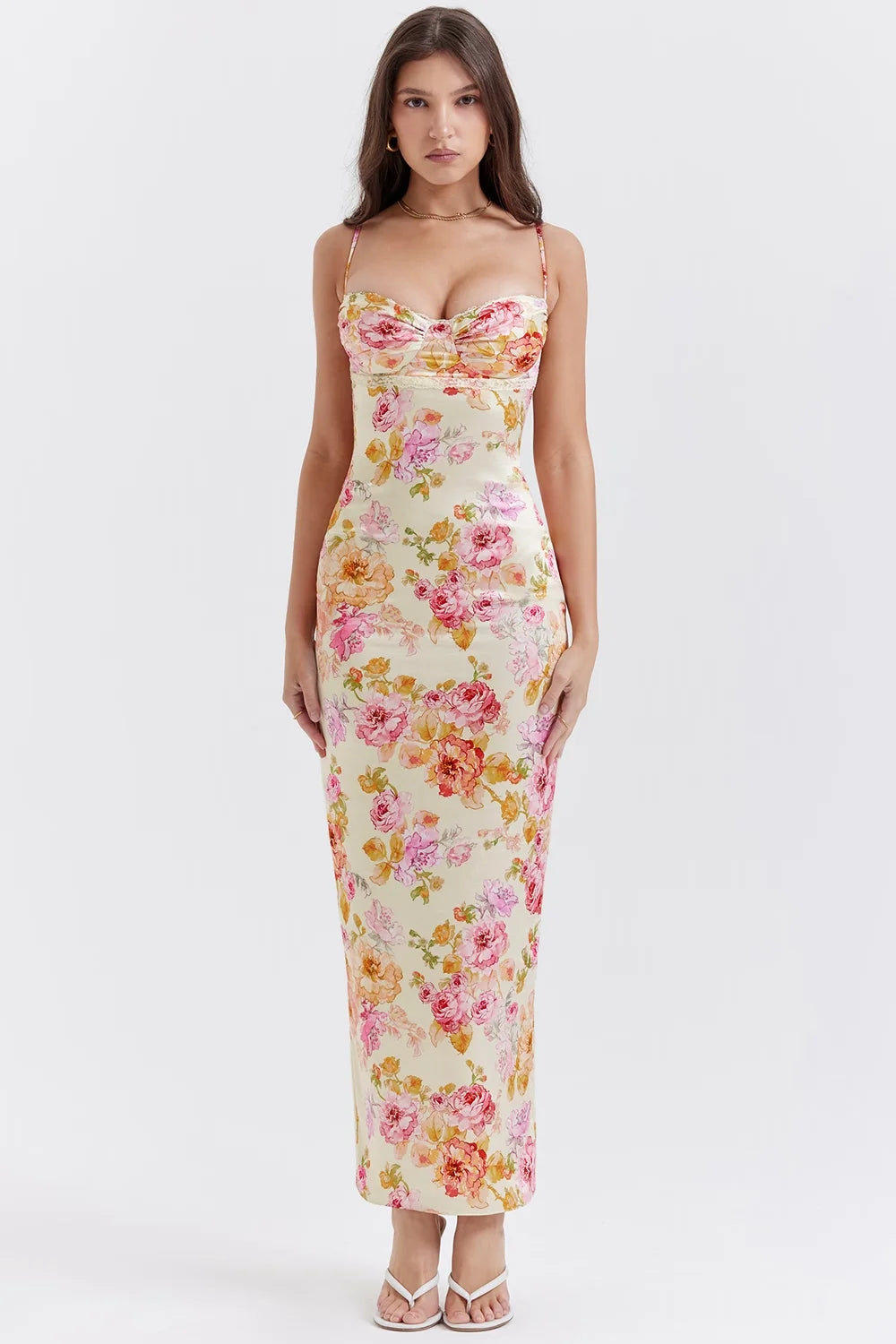 Floral print fitted maxi dress with yellow base featuring a lightweight and flowy fabric perfect for a breezy summer day.