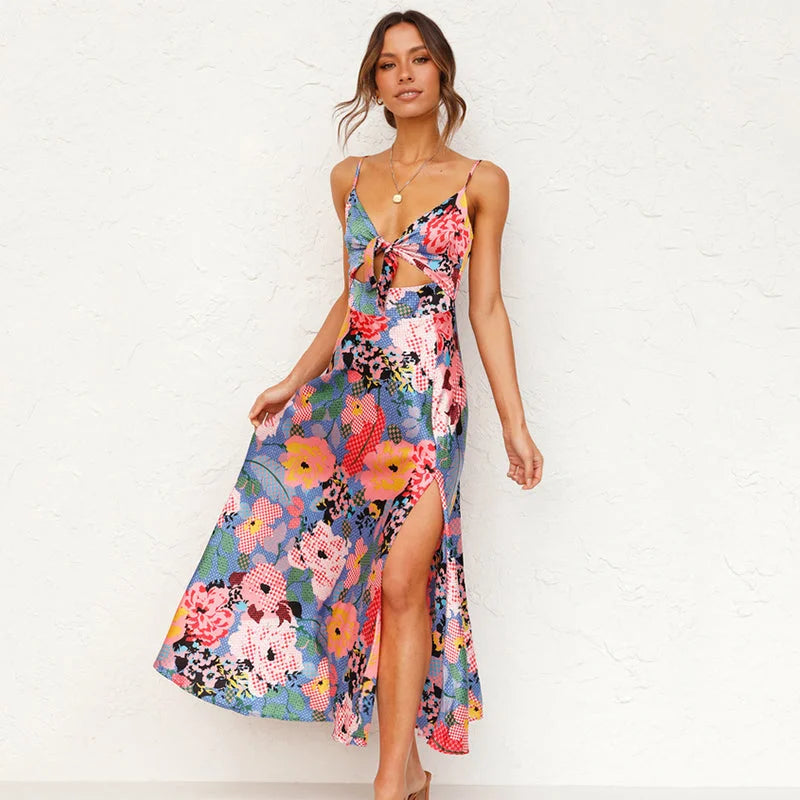 "Flowy pink maxi dress with a delicate floral print design, perfect for a feminine and charming look."