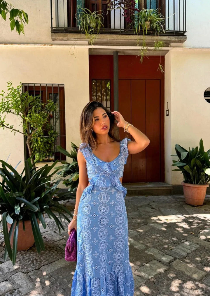 Blue patterned maxi dress with ruffles, has a beautiful flowing design perfect for any occasion.