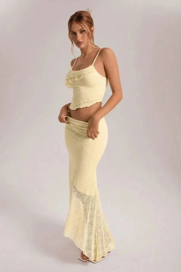 Cream lace crop top and skirt set for women in a matching design. Delicate lace material adds a touch of elegance to this…