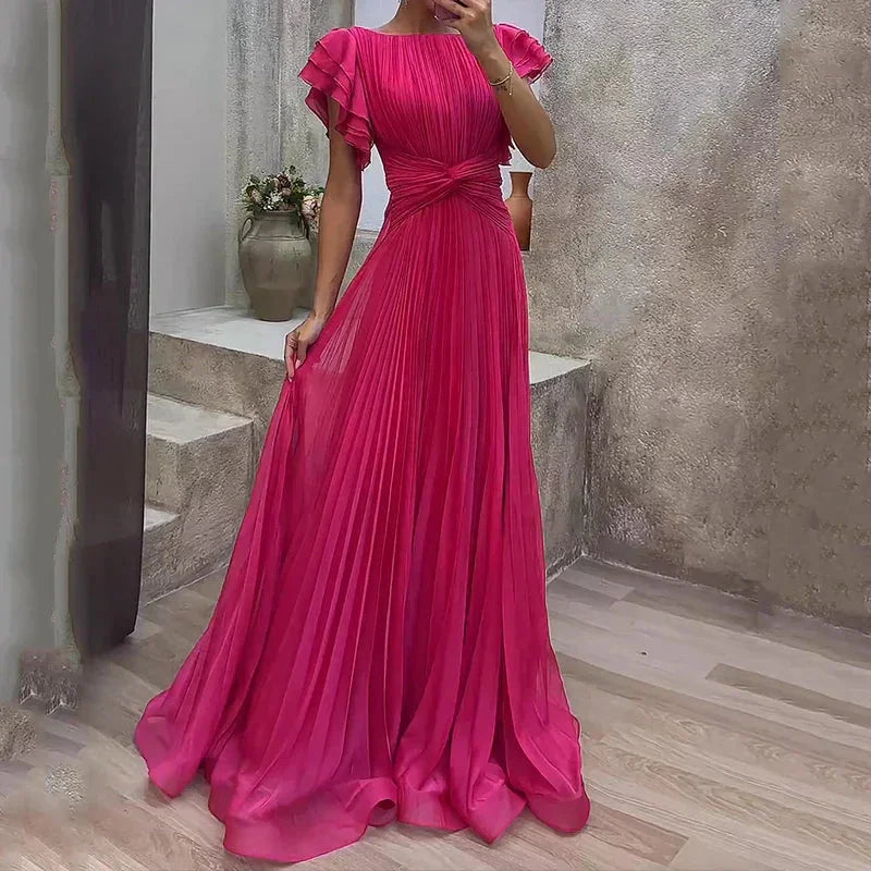 "Jaziah maxi dress featuring pleats, ruffled sleeves, and flowing silhouette in a lightweight fabric."