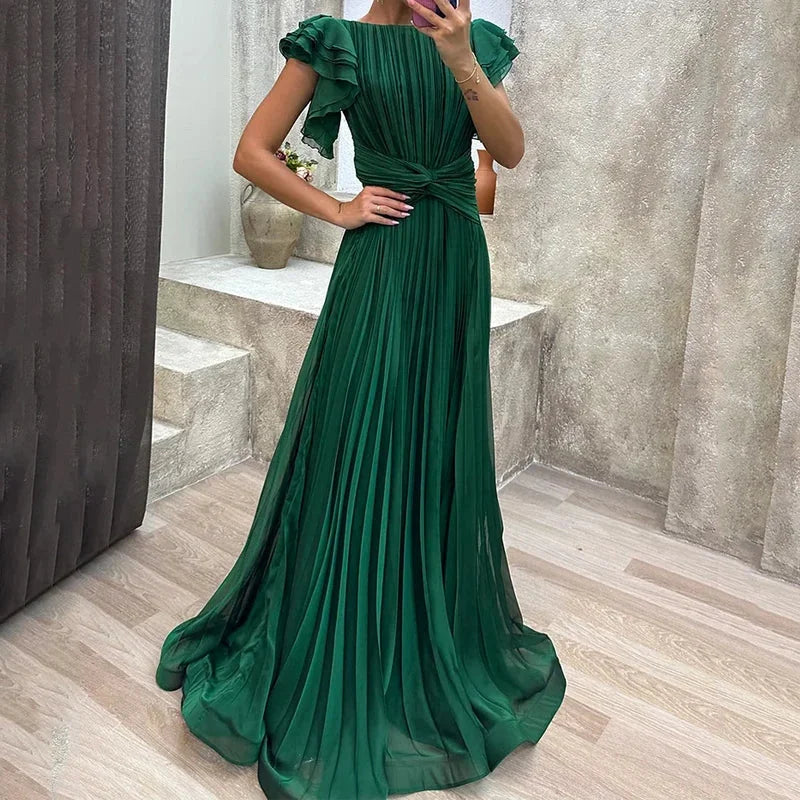 Green pleated maxi dress with ruffled sleeves, made from flowy polyester fabric. Perfect for a stylish and elegant look.