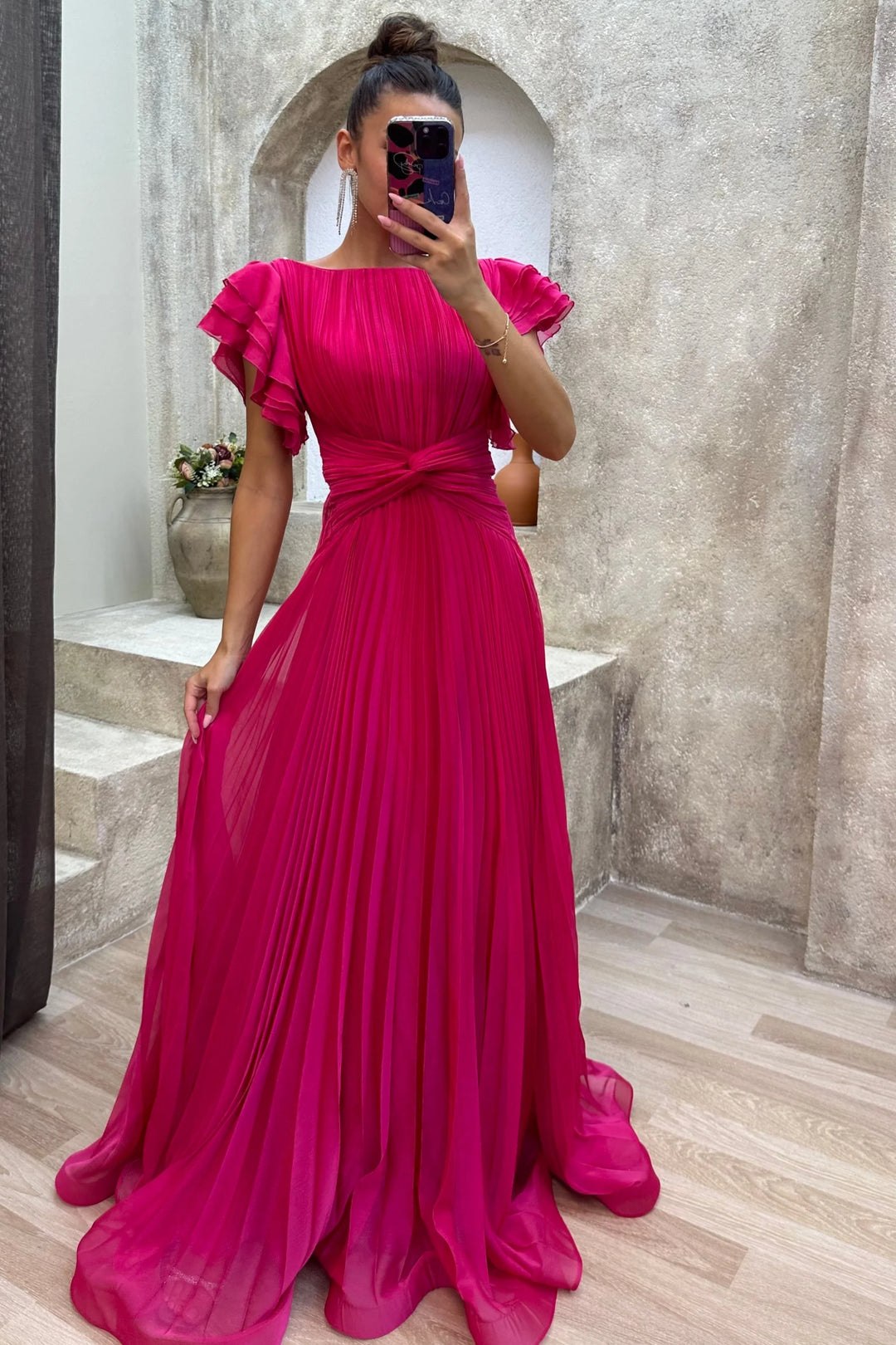 Pink pleated maxi dress with ruffled sleeves, perfect for effortless style. Made with high-quality fabric for a feminine,…