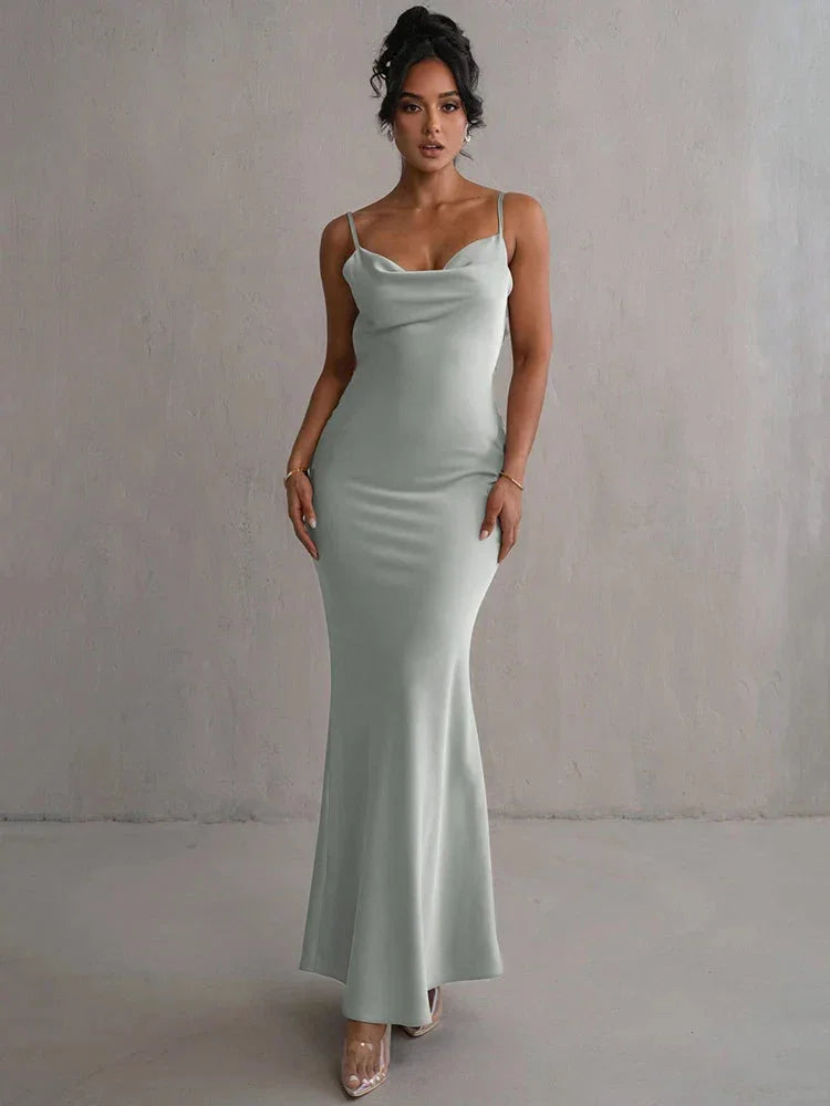Sleeveless maxi dress featuring floral accents, made with a lightweight fabric perfect for warm days.