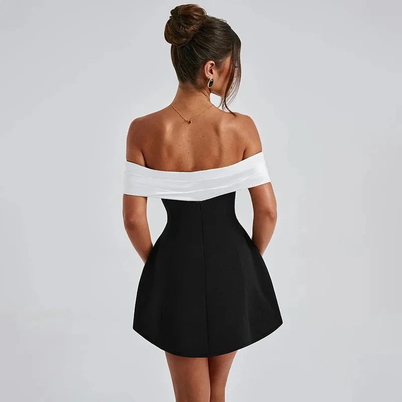 Off-shoulder dress in two-tone design, with a sleek and stylish look perfect for any occasion.