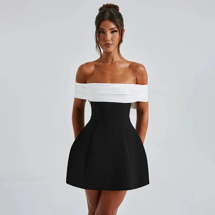 Black off-shoulder dress by Jessica featuring a sleek two-tone design. Made of high-quality fabric with a flattering and…