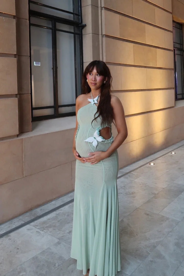 "Jewels mint green mermaid-fit maxi dress with halter neck, perfect for a glamorous yet comfortable look."