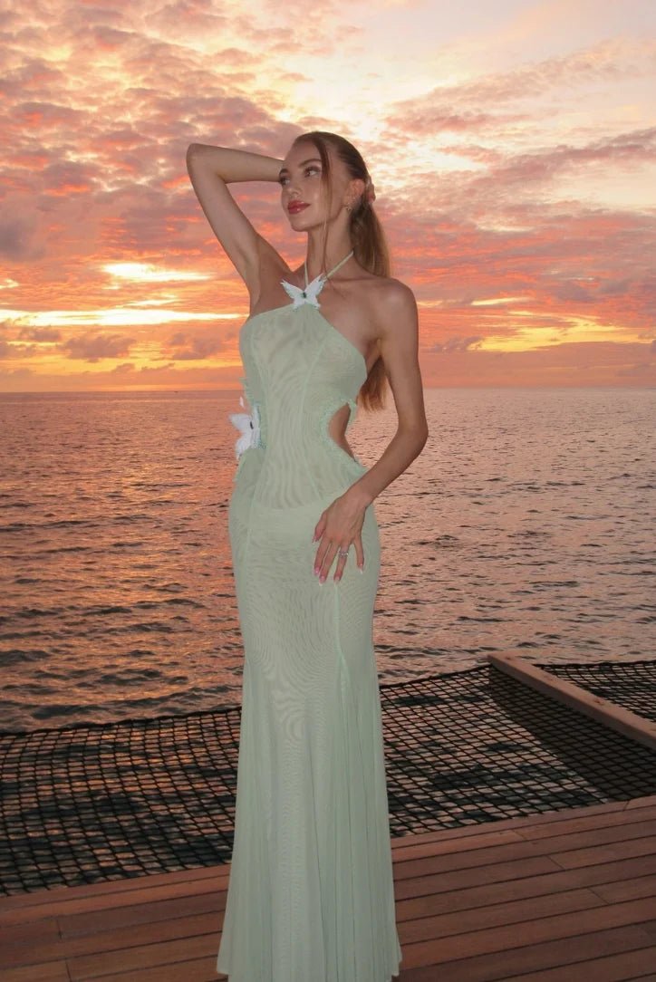Mint mermaid-fit maxi dress with halter neck design, perfect for summer events.