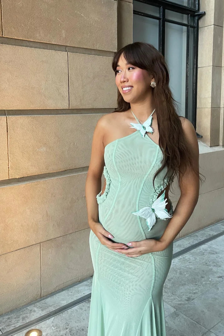 "Halter neck mint maxi dress featuring mermaid-fit design, ideal for special occasions and events."