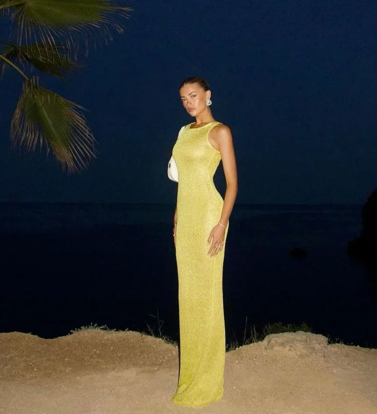 "Sleeveless black maxi dress with sparkling embellishments, perfect for evening events"