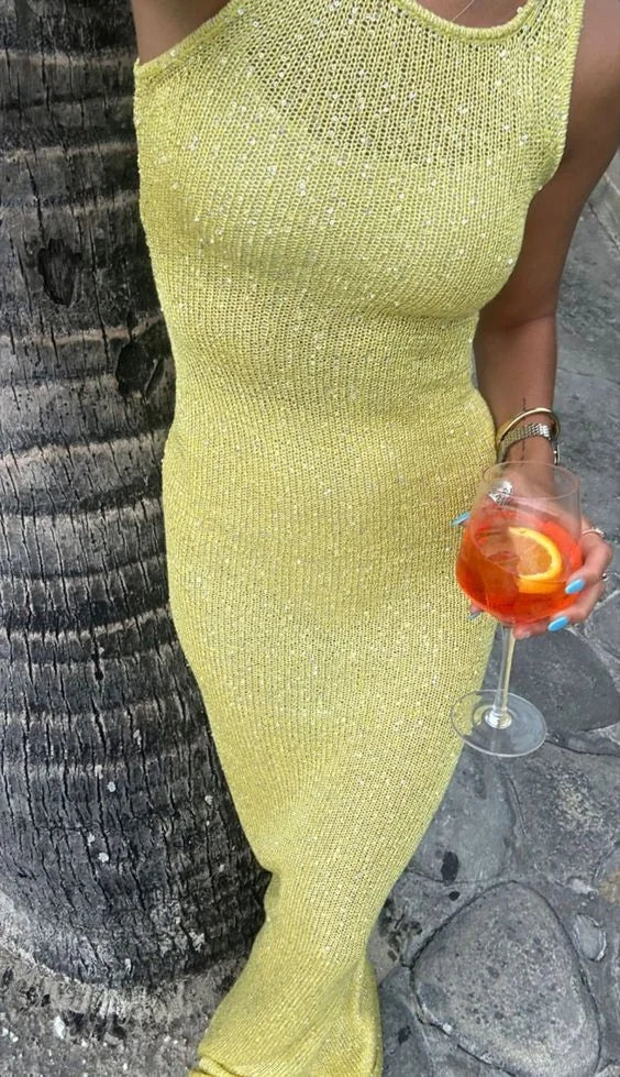 Sleeveless maxi dress in sparkling fabric with a relaxed fit, ideal for evening wear.