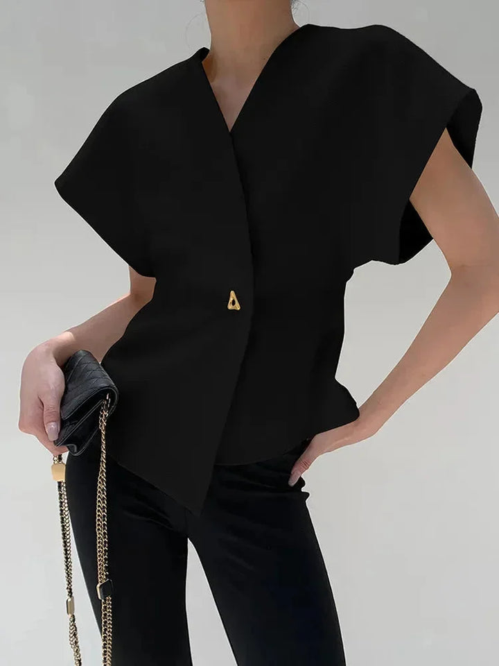 "Wrap-style blouse with sculpted sleeves in a chic and sophisticated design, perfect for a stylish and elegant look."
