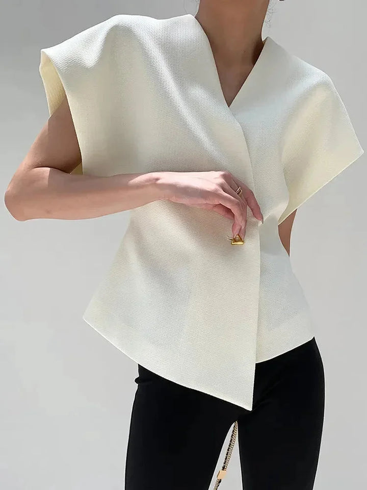 "Jolene wrap-style blouse in red crepe fabric with sculpted sleeves and elegant design"