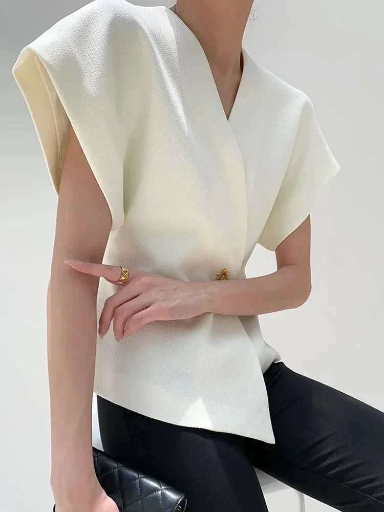 "Jolene blouse in a wrap style with sculpted sleeves, chic and modern design in soft and flowy fabric"