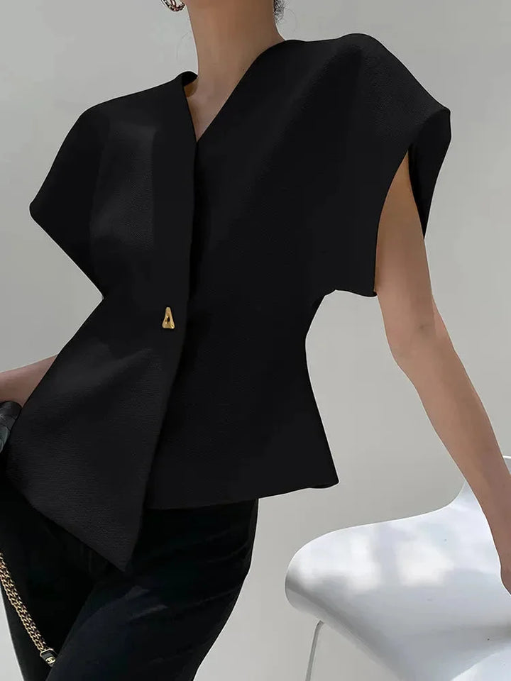 Black wrap-style blouse with sculpted sleeves, elegantly draping in soft, flowy fabric. Chic and versatile addition to any…