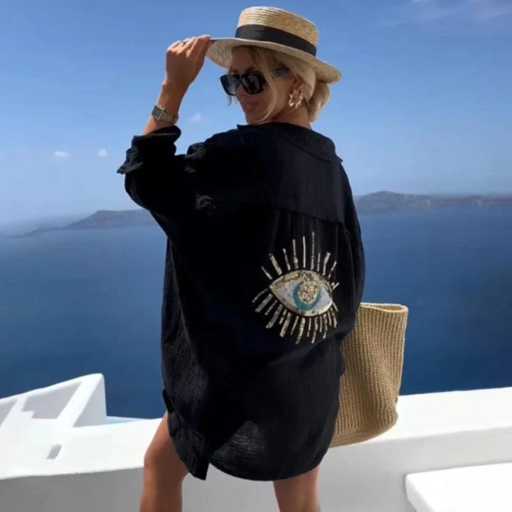 "Women's breezy oversized blouse with eye motif, crafted in lightweight fabric for a relaxed fit."