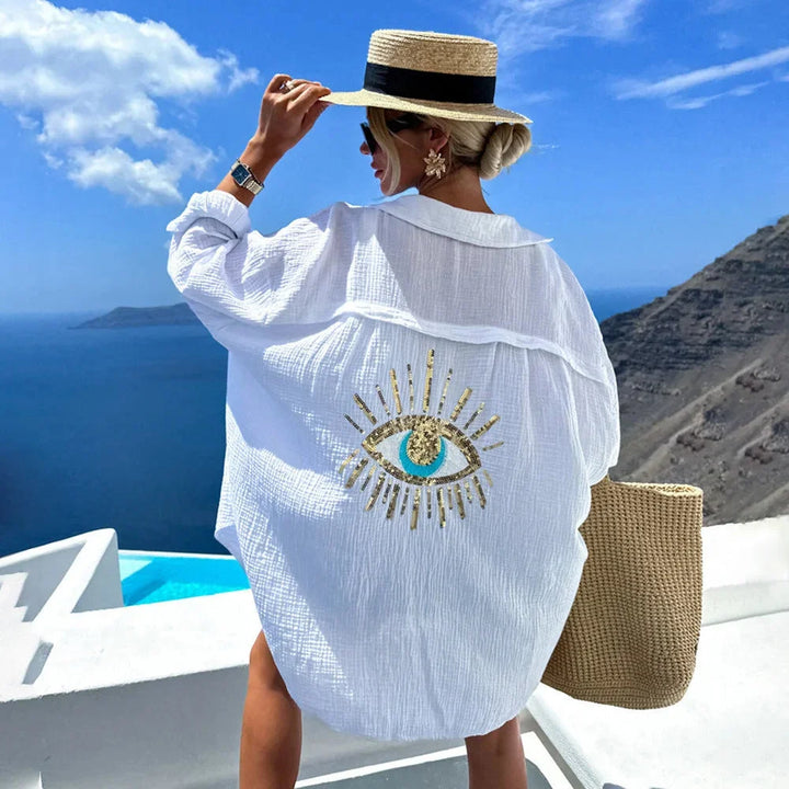 White oversized blouse with eye motif design for women by Journii. Features a breezy style perfect for casual occasions.