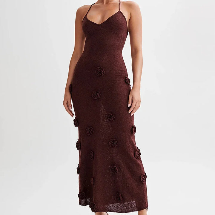Floral embellished maxi dress in a flowing silhouette featuring delicate floral embroidery on a soft and lightweight fabric.