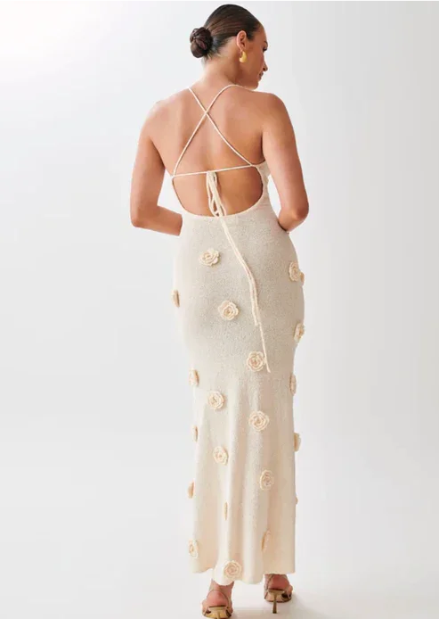 "Floral embellished maxi dress in soft fabric with intricate details for an elegant and feminine look."