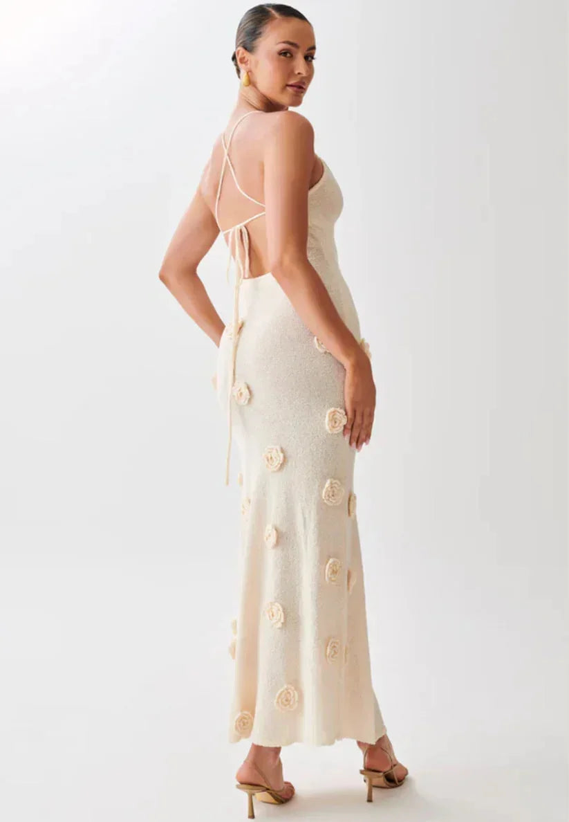 "Floral embellished maxi dress featuring intricate embroidery and a flowy silhouette, ideal for summer outings and special…