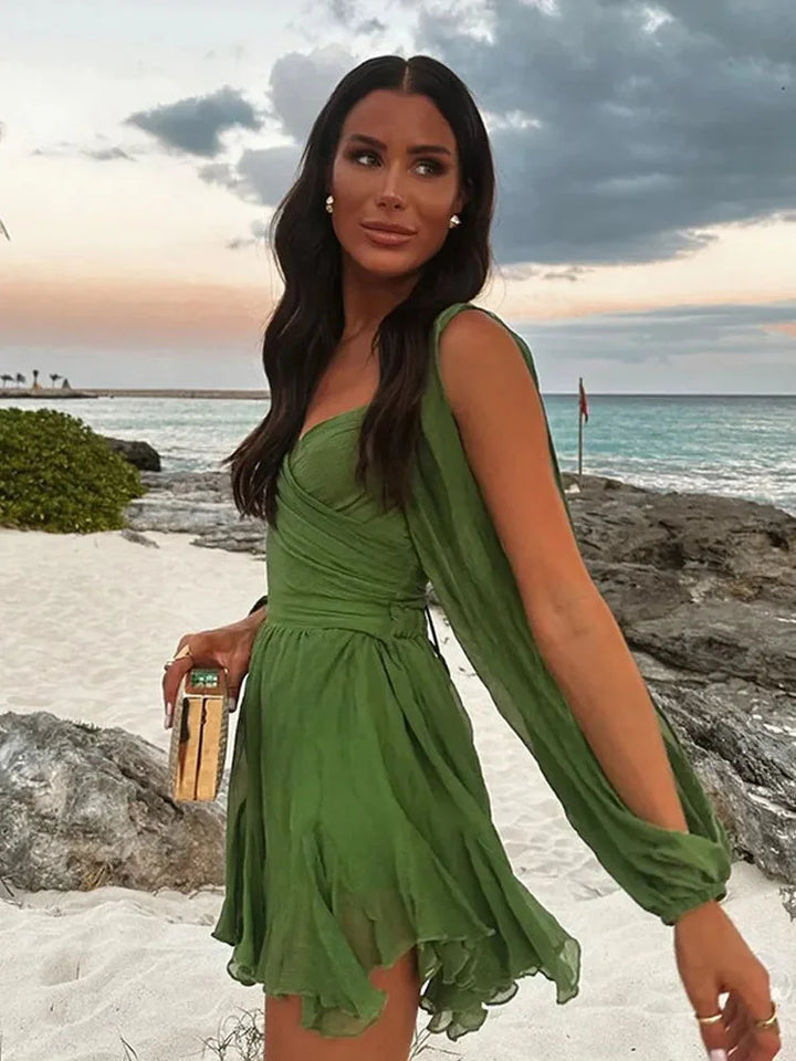 Green dress with puff sleeves and ruffled hem made from lightweight cotton fabric. Classic design for a stylish and elegant…