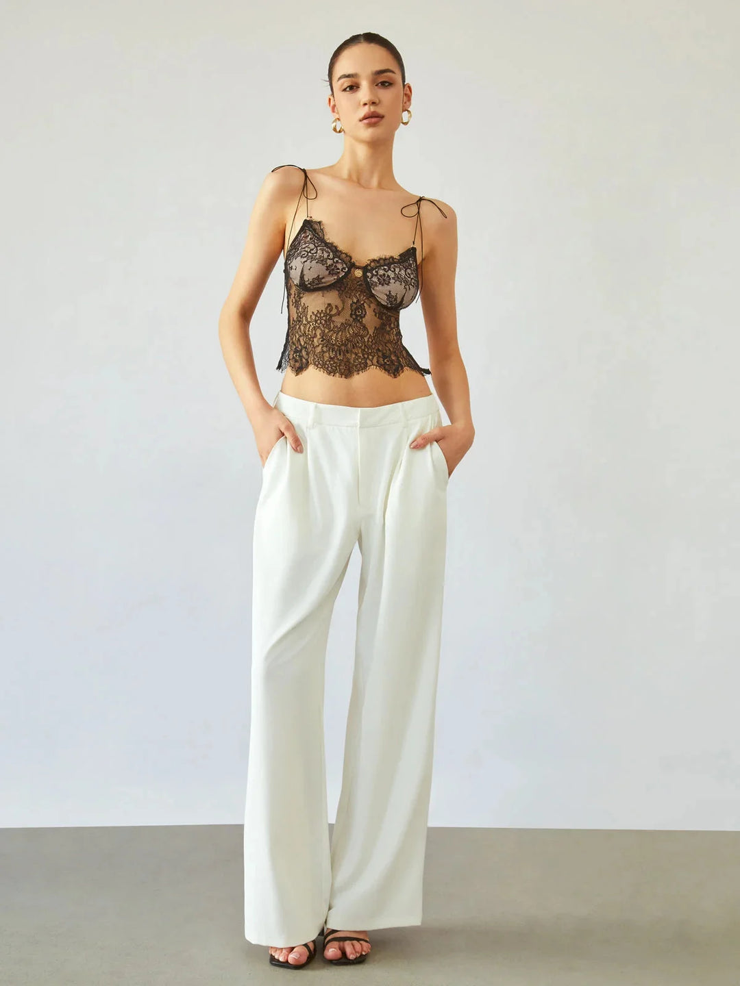 "Judith lace camisole top in white, adjustable straps, floral lace design, ideal for layering or standalone wear."