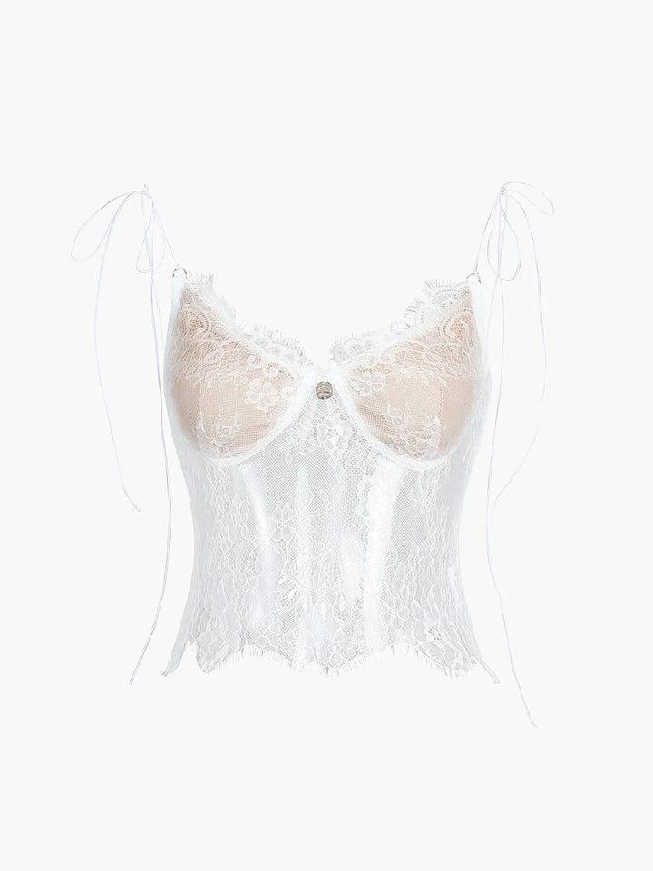 White lace camisole top with adjustable straps by Judith. Feminine and delicate design perfect for layering or wearing on…
