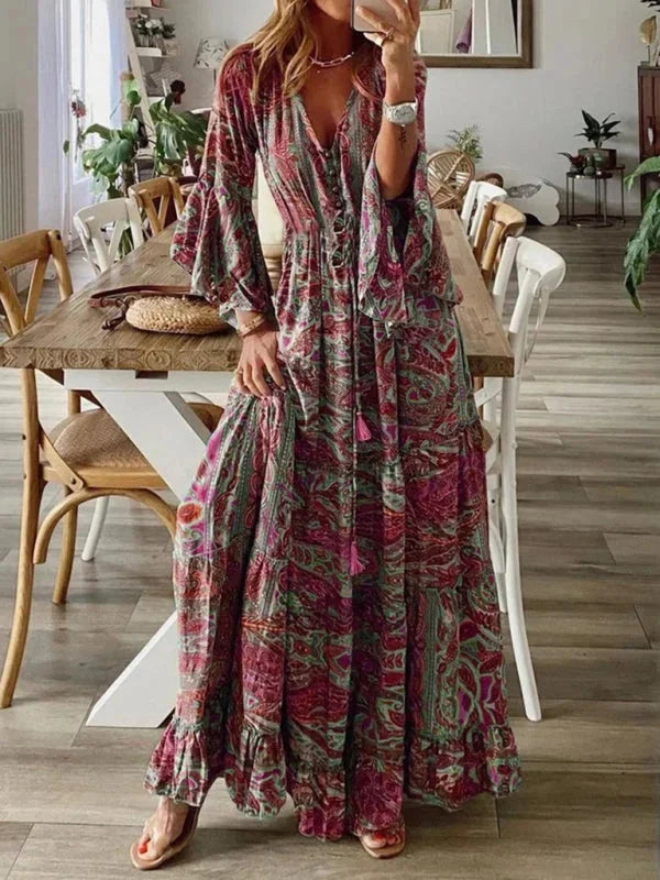 Bohemian dress with flared sleeves in soft flowy fabric, featuring intricate embroidery and a relaxed fit.