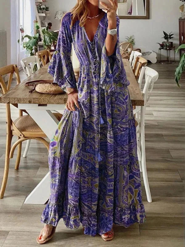 Purple bohemian dress with flared sleeves made from lightweight and breathable fabric, perfect for a casual chic look.'