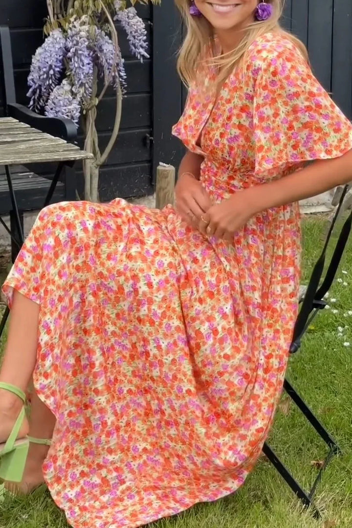 Floral maxi dress for women in soft chiffon with v-neck, short sleeves, and flowy fit, perfect for summer occasions.