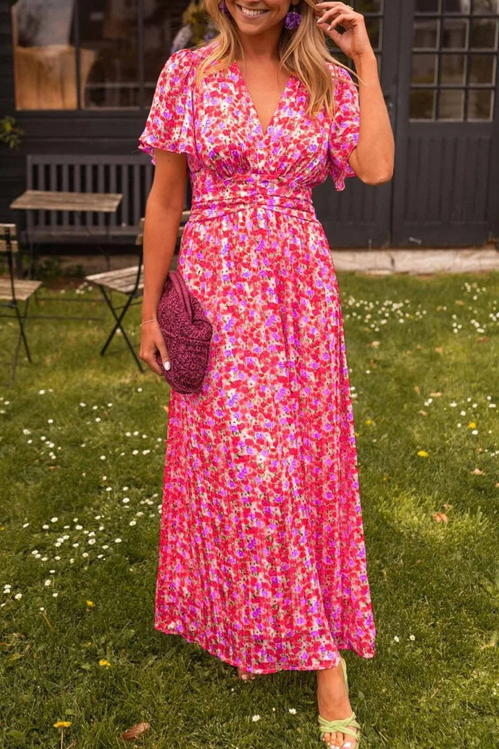 Pink floral maxi dress for women, featuring a flowy design and made from soft, breathable fabric.