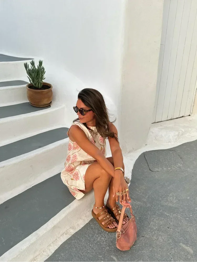 Pink floral A-Line sleeveless dress, featuring a delicate floral pattern on a lightweight fabric, ideal for a breezy summer…