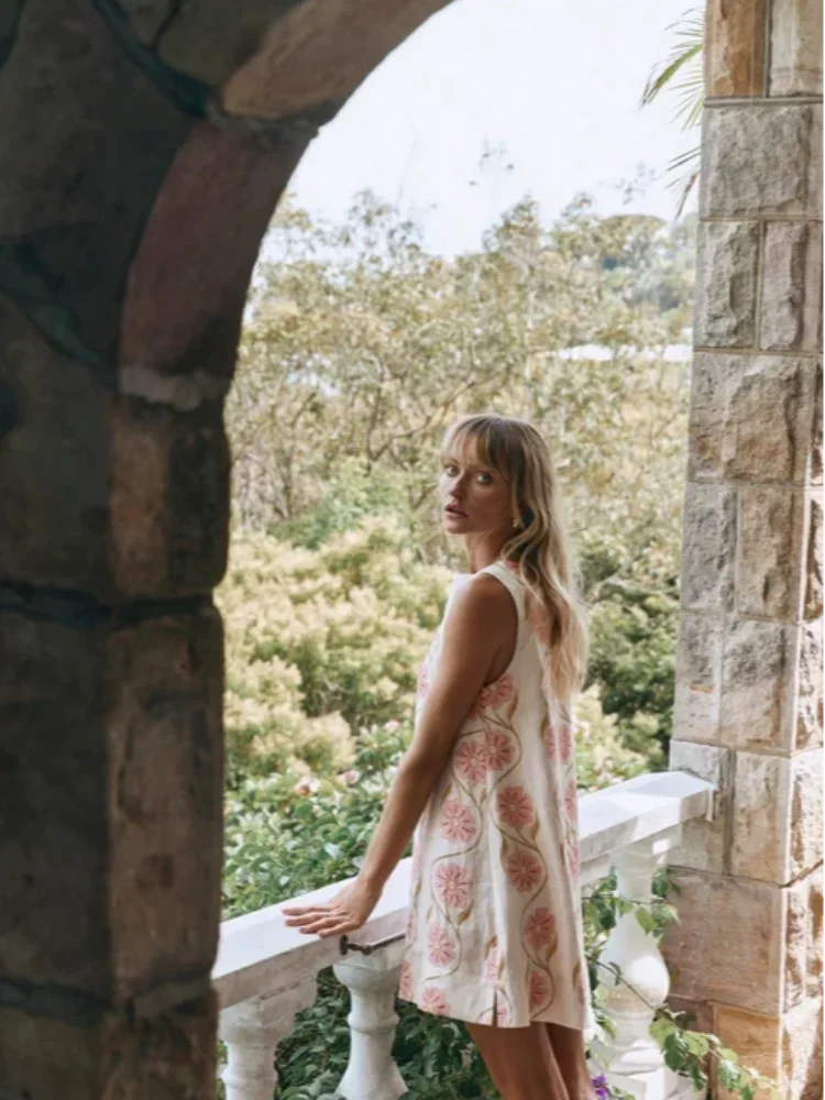 Pink sleeveless A-Line dress with floral pattern. Made with breathable fabric, perfect for summer outings.