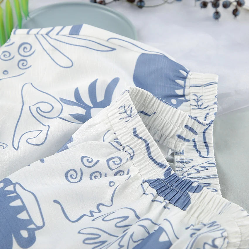 White and blue patterned set featuring a delicate floral design on soft cotton fabric.