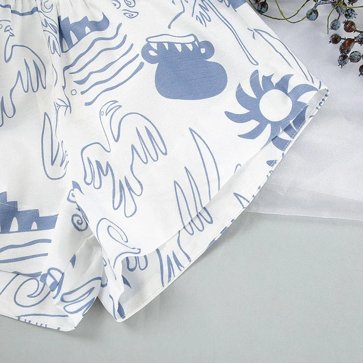 Kaari white and blue patterned set featuring intricate geometric design, crafted in soft cotton blend for all-day comfort.