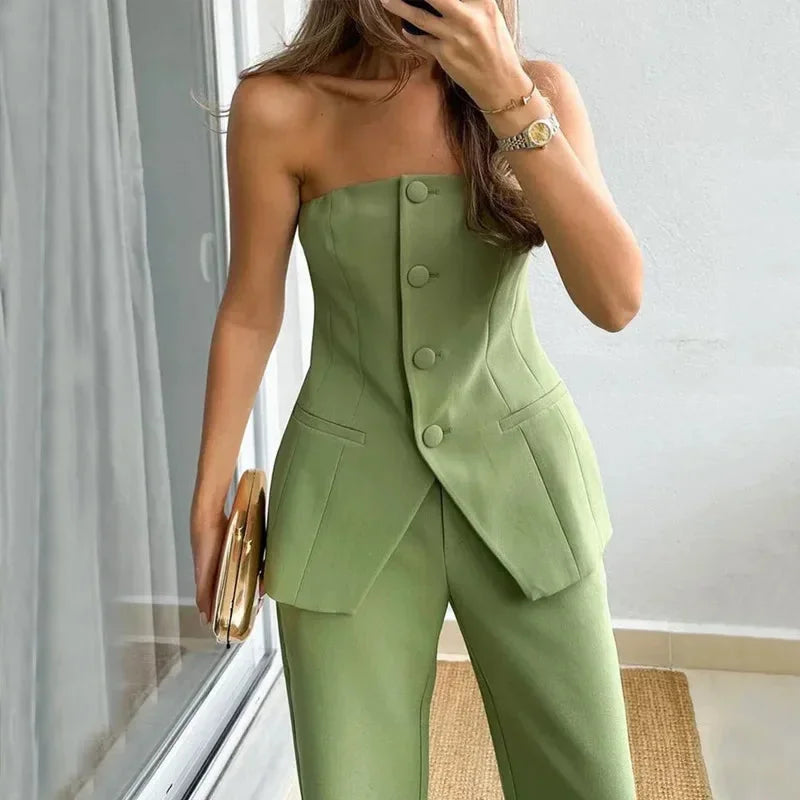 Black strapless top and high-waisted pants set made of stretchy cotton blend. Chic and stylish ensemble for a trendy look.