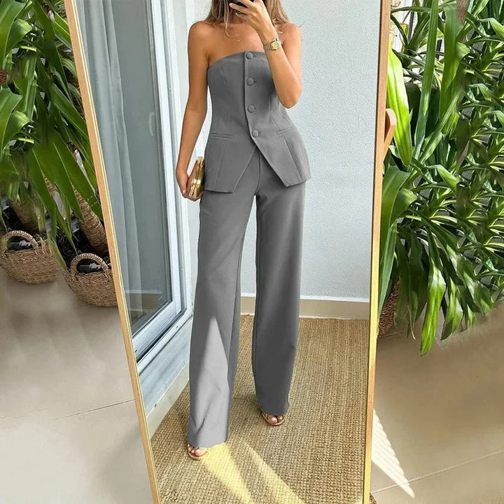 "Grey strapless top with high-waisted pants set, perfect for chic and trendy looks. Comfortable and stylish fabric blend."
