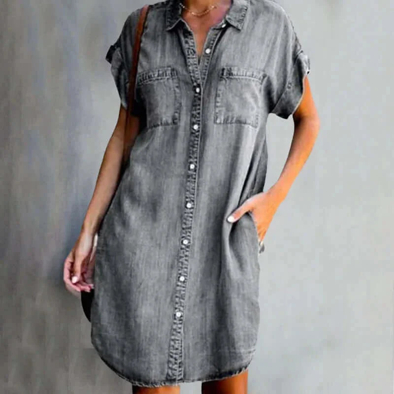 Gray denim dress with pockets, button-front design. Casual and stylish, perfect for everyday wear.
