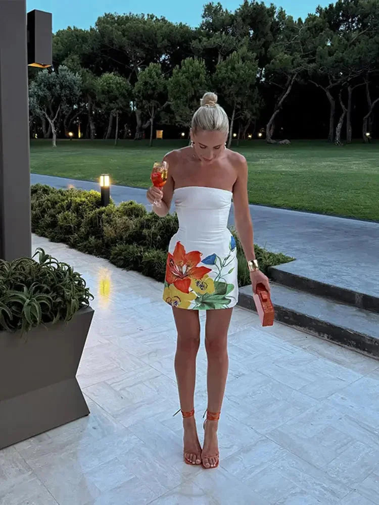 Strapless mini dress in vibrant floral print, made from soft and breathable fabric.