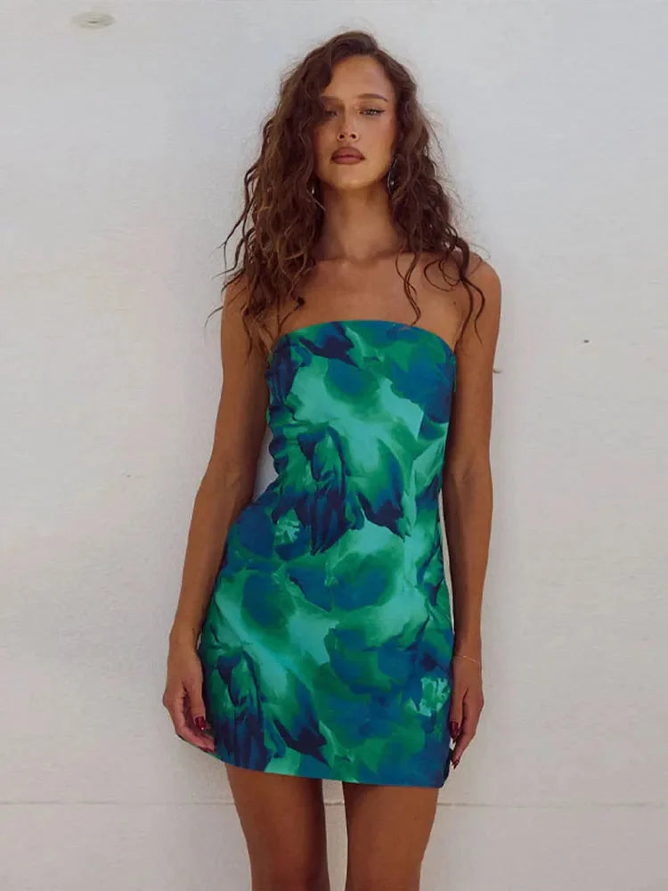 Strapless mini dress in Green with vibrant floral design, perfect for a summer event.