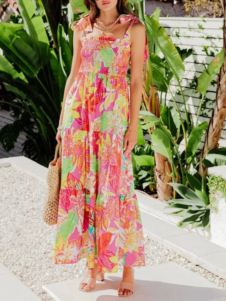 Sleeveless red maxi dress with tropical print for women, perfect for summer outings, made with lightweight and breathable…